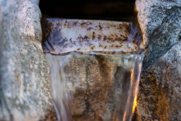 Old stone drinking water fountain 