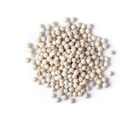 white peppers corn on the white background. top view