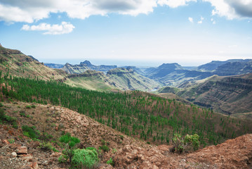 Naklejka premium Mountain valleys among the rocks on the Canary Islands, distant horizon