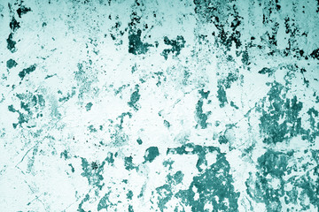 Сraked weathered cement wall texture in cyan tone.