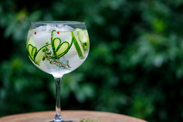 Gin and tonic with cucumber hearts and thyme