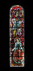 Saint Joan of Arc receive visions of the Archangel Michael, St Margaret and St Catherine, stained glass window in Basilica of the Sacred Heart of Jesus in Paris