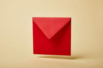 red and bright envelope on colorful and yellow background with copy space