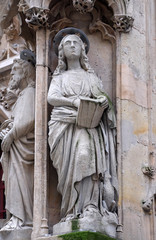 Fototapeta premium Saint John the Apostle, statue on the portal of the Saint Merri Church, Paris, France