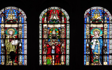 Holy Trinity between Saints Mark and Luke, stained glass window in Saint-Eustache church in Paris,...
