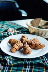 Triangular toast sandwiches with lettuce and ham on a plate
