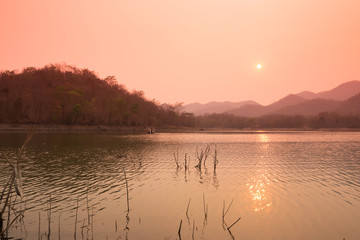 Villagers are catching fish by fish trap (net trap) in reservoir