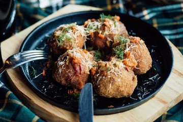Stewed meatballs with vegetables on the table
