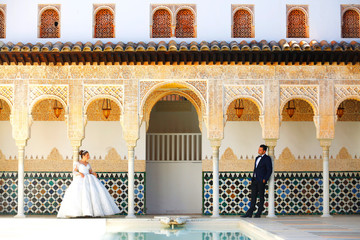 Wedding couple posing in old arabic house