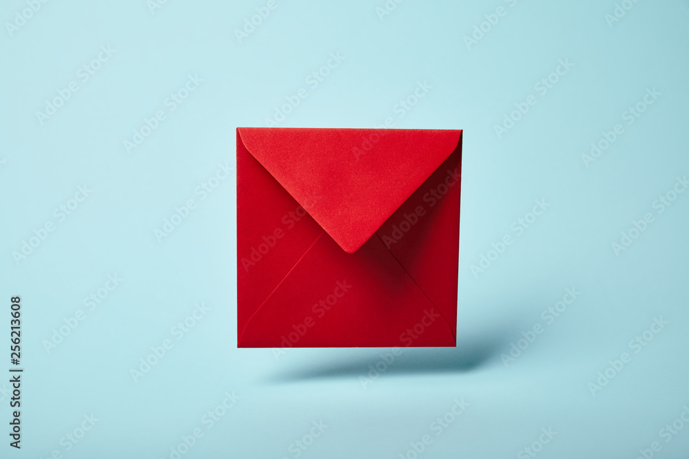 Canvas Prints red and bright envelope on blue background with copy space