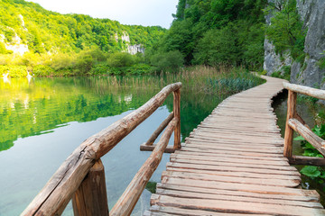 Fototapeta premium Boardwalk through the lake of Plitvice Lakes National Park, Croatia