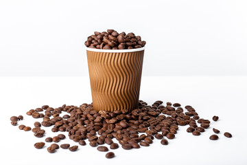 Craft coffee cup full of coffee bean on white background