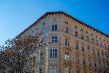 yellow corner building with darken blue sky