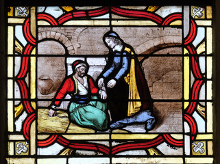Saint Vincent de Paul helps a prisoner, stained glass window from Saint Germain-l'Auxerrois church in Paris, France