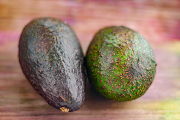 Avocados on a wood background