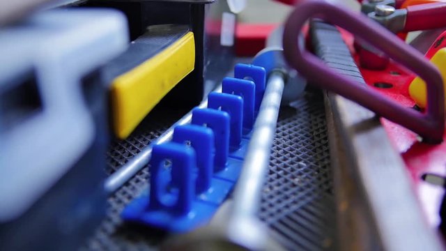 Paintless Dent Repair. Blue Glue Tabs. Dent Remover Hot Melt Glue Gun. Overview tools for aligning dents on the machine without painting in the workshop isolated.