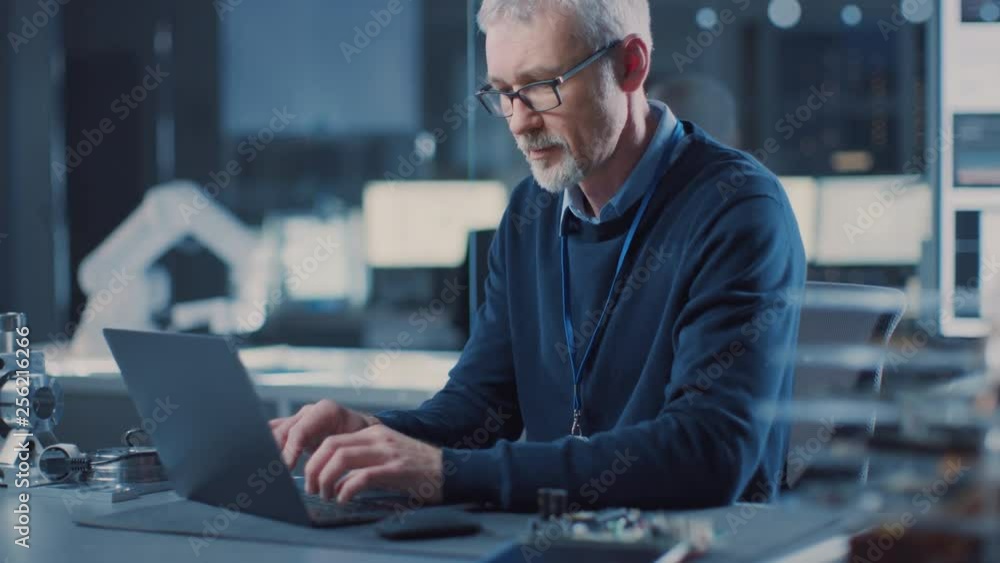 Leinwandbilder professional electronics design engineer wearing glasses works on laptop in research laboratory, tur