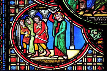 Fototapeta na wymiar Christ Driving the Merchants from the Temple, stained glass window from Saint Germain-l'Auxerrois church in Paris, France 