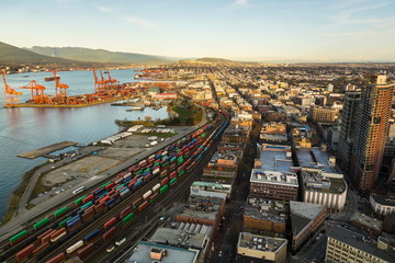 Aerial view of Vancouver’s port and city with mountains in the background, Vancouver, British...