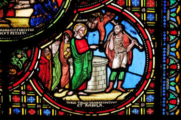 Jesus heals a lame man, stained glass window from Saint Germain-l'Auxerrois church in Paris, France 