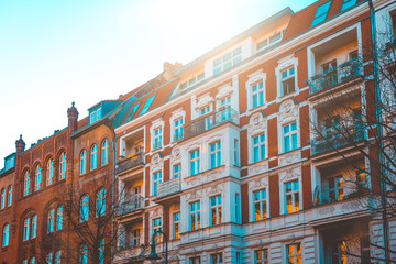 Fototapeta premium red apartment house with white detailed ornaments