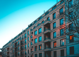 modern brick apartment houses on a cold day with darken blue sky