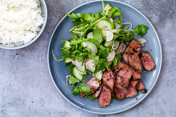 Asian beef  with cucumber salad