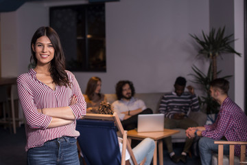 Portrait of young businesswoman in work environment