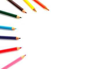 Crayons lined up isolated on white background.