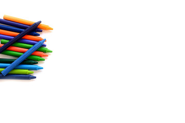 Crayons lined up isolated on white background.