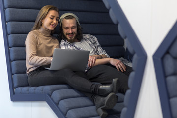 Couple working together in modern workspace