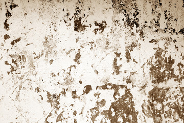 Сraked weathered cement wall texture in brown tone.