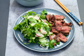 Asian beef  with cucumber salad