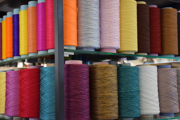 Large colorful polypropylene thread set in rainbow mood. Multicolor bobbin thread. Polypropylene multifilament yarns. Set of sewing thread coils, miscellaneous colours.