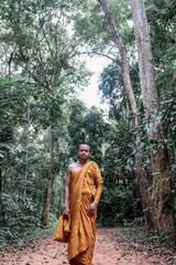 Fototapeta na wymiar Buddhist monk meditation in tropical forest