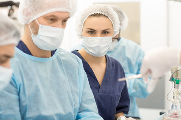 Fototapeta premium Professional surgeons during operation in surgery room