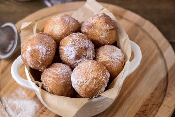 Tasty Homemade Cottage Cheese Donuts in Sugar Powder Wooden Background Donuts Above
