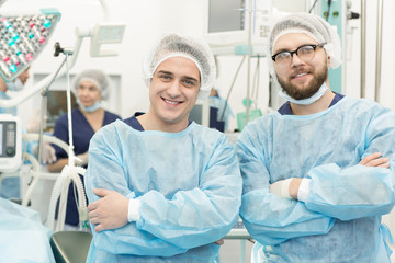 Surgical team posing in an operating theatre