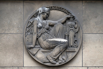 Stone relief with the Renaissance symbol at the building of the Faculte de Medicine Paris, France 