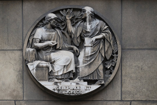Asclepiade and Lucrece, Greek medicine in Rome. Stone relief at the building of the Faculte de Medicine Paris, France