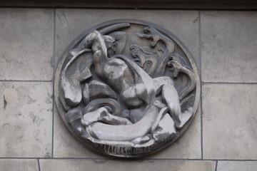 Heracles and Hydra. Stone relief at the building of the Faculte de Medicine Paris, France