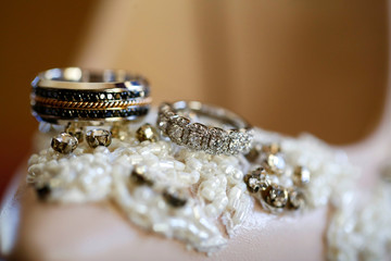 Close up with beautiful pink shoes and luxury rings