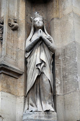 Obraz premium Saint Radegund statue on the portal of the Saint Germain l'Auxerrois church in Paris, France 