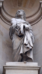Obraz premium Saint Protais statue on the facade of Saint Gervais and Saint Protais Church, Paris, France