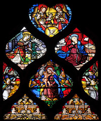 Holy Trinity, Annunciation of the Virgin and Virgin with Child, stained glass windows in the Saint...