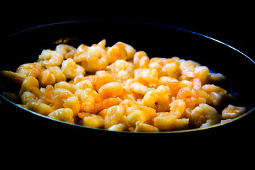 Ready cooked prawns on a frying pan. Healthy eating or dieting concept.