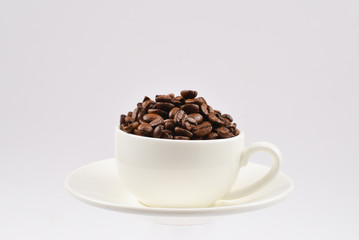 Cup of coffee and coffee beans.