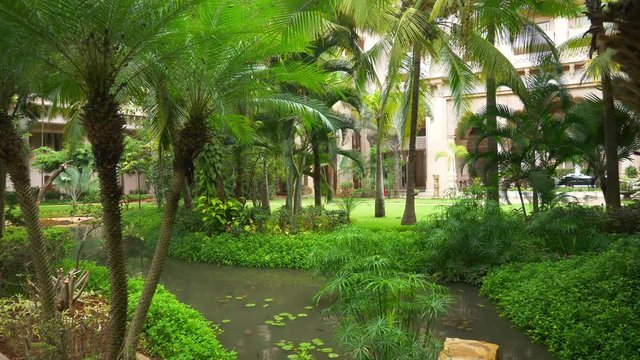 day time bangalore city famous luxury hotel garden pond walking panorama 4k india