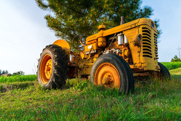 agricultural tractor in a countryside scenery