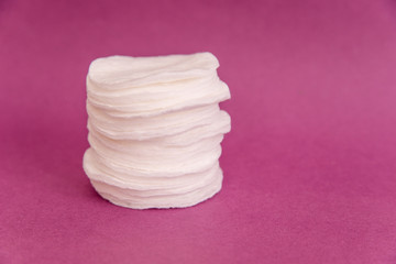 cotton pad on pink background © Маргарита Семенчуков